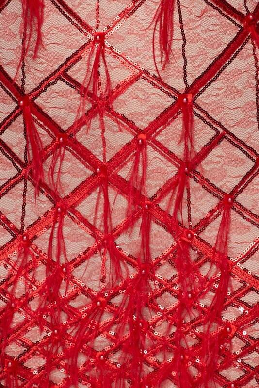 a close up of a red metal structure