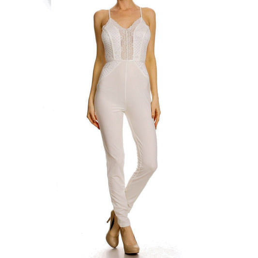 a woman in a white dress standing on a bench