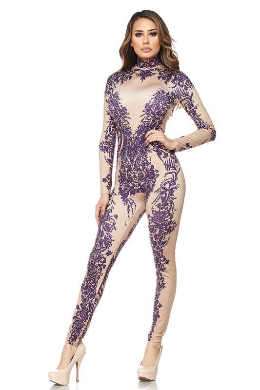 a woman standing in front of a wall