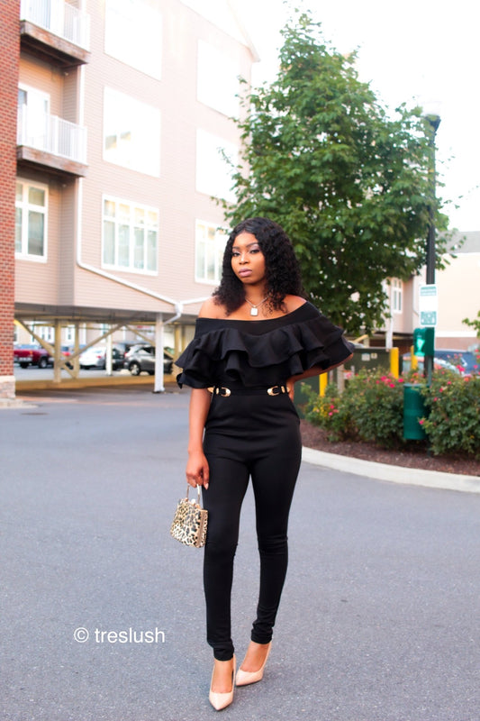 a woman is walking down the street with a skateboard