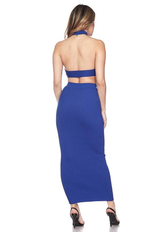 a woman standing on a tennis court holding a racquet