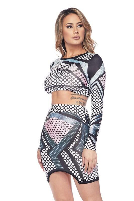 a woman is posing for a picture with a tennis racket