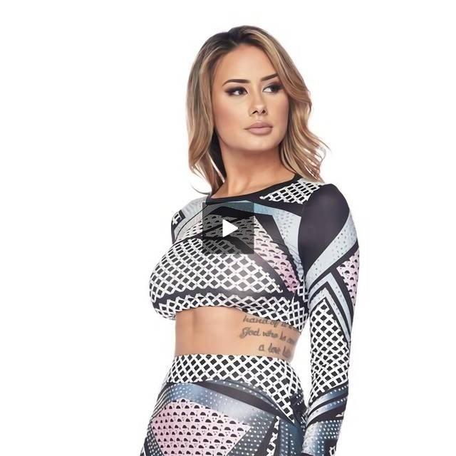 a woman is sitting on a bench holding a cell phone