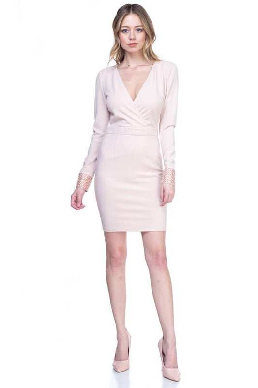 a woman standing in a white dress holding a tennis racquet