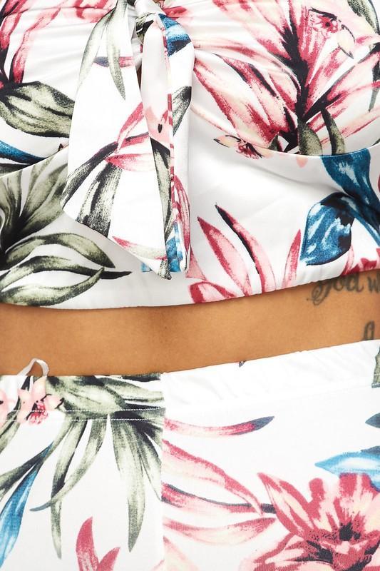 a person laying on a bed with a blanket