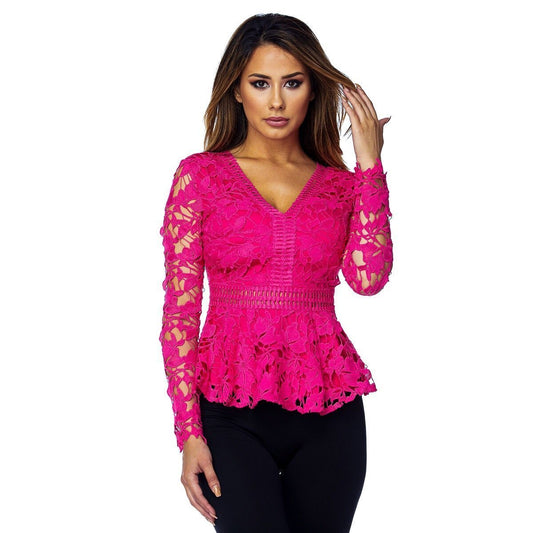 a woman in a pink dress holding a cell phone