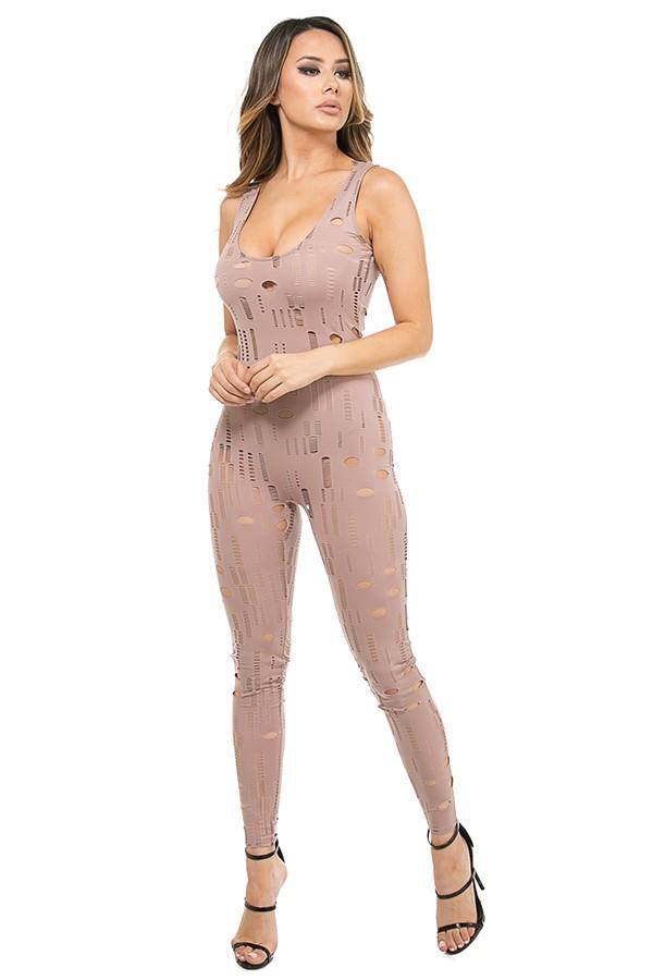 a woman in a dress standing on a wall