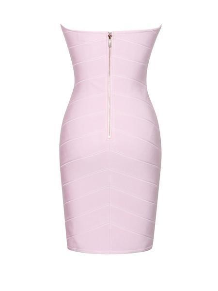 a white vase with a pink flower in it