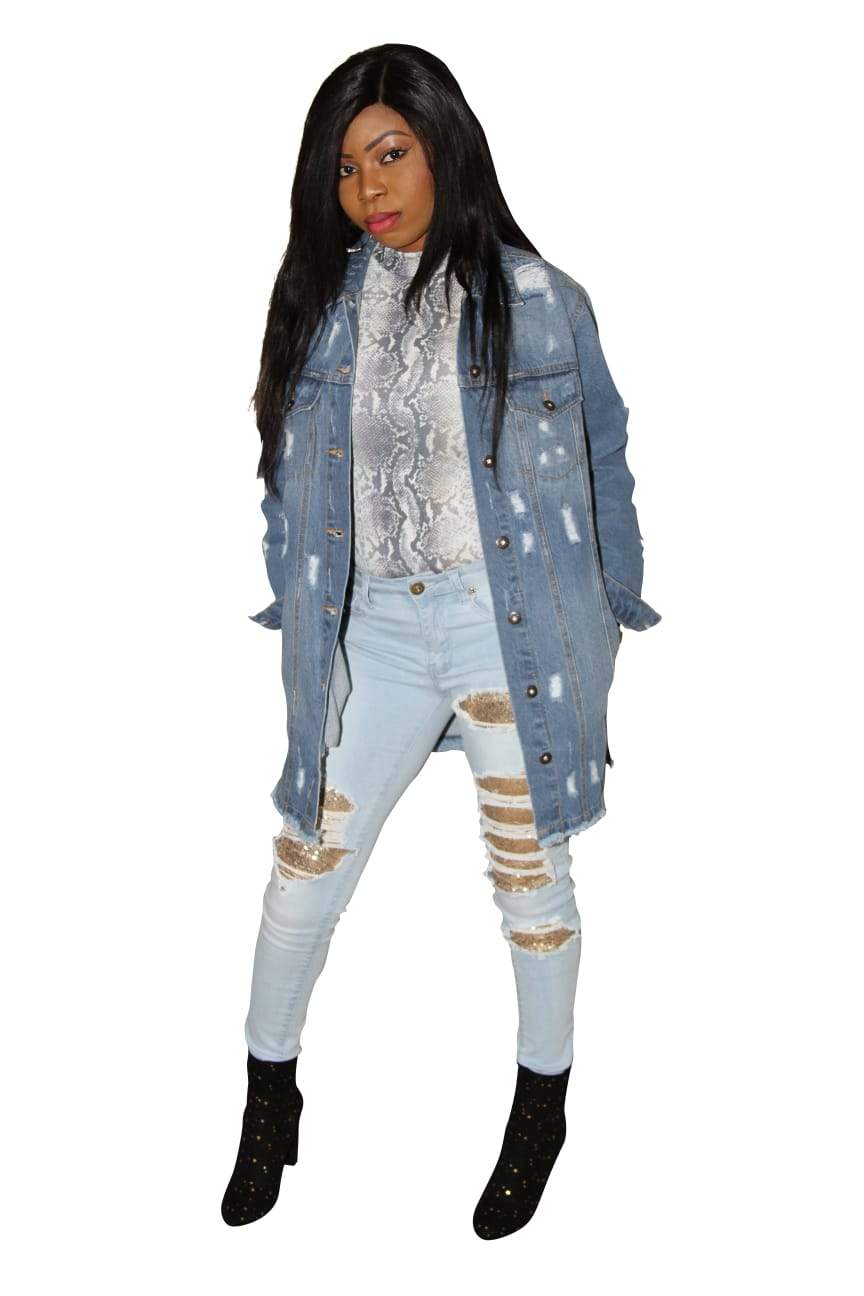 a woman in black jacket standing on a snowboard