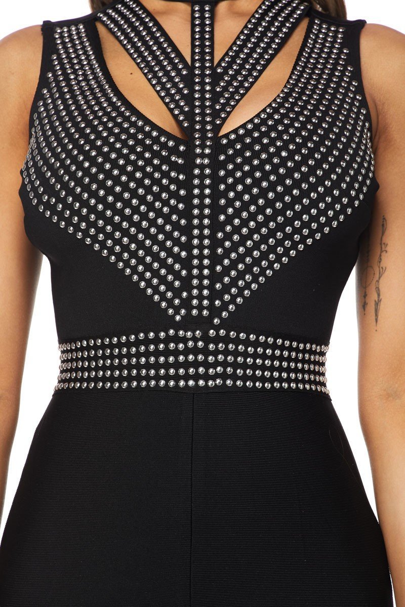 a woman in a black dress shirt and black tie