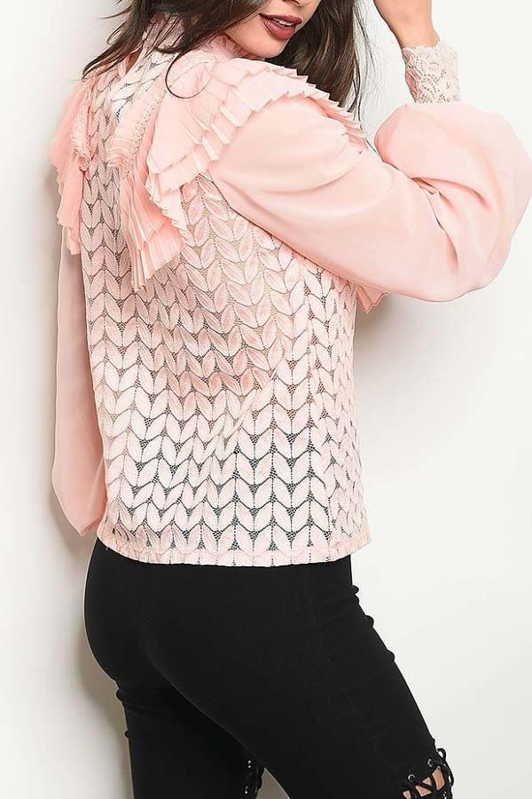 a woman holding a cell phone in her hand