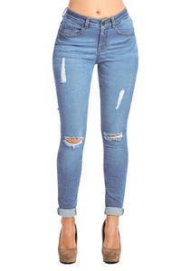 a woman is standing on a skateboard