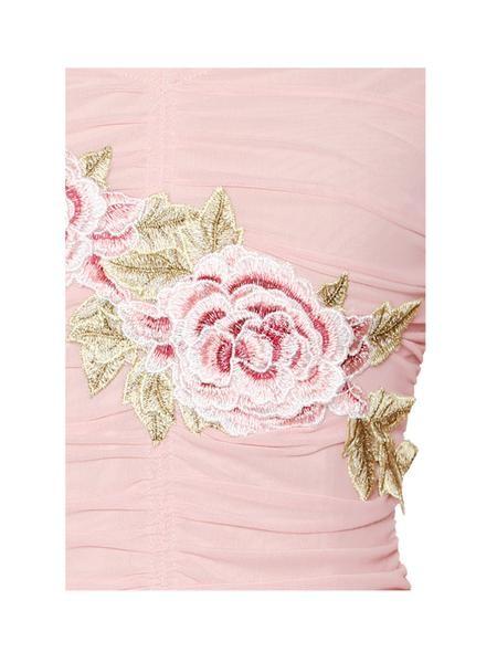 a pink rose is in a pink vase