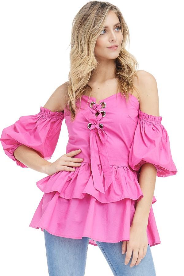 a young girl wearing a pink dress and a pink dress 