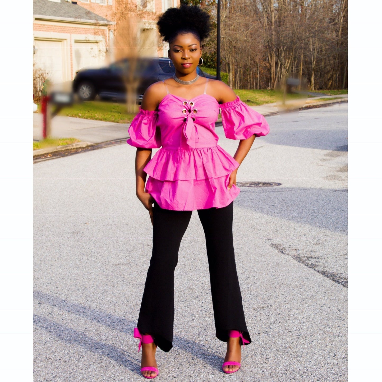 a woman in a pink dress holding a pink umbrella 